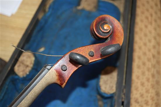 A German Strad style violin and a small violin and two bows